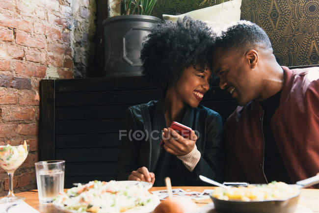Couple sharing meal together in cafe — Stock Photo