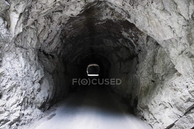 Diminishing perspective of tunnel in rock, Dornbirn, Vorarlberg, Austria — Stock Photo