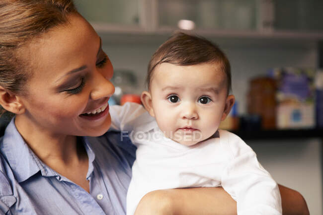 Mother holding baby girl — Stock Photo