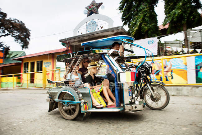 Family riding in alternative transport — Stock Photo