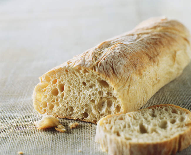 Close up shot of sliced ciabatta bread loaf — Stock Photo