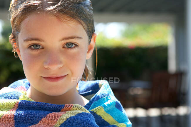 Portrait of young girl wrapped in a towel — Stock Photo