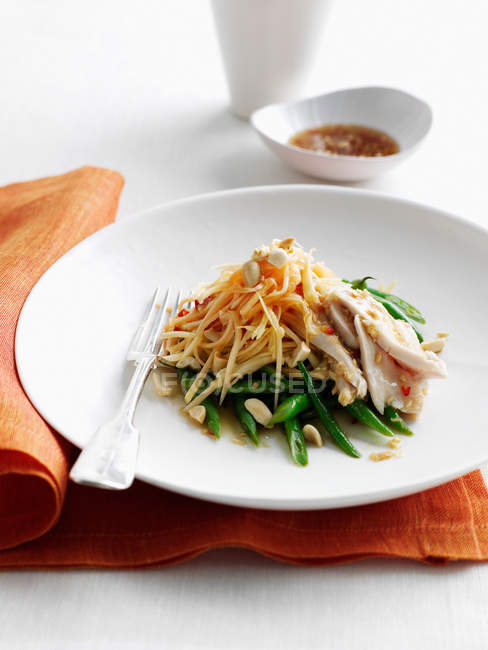 Chicken with noodles and beans — Stock Photo