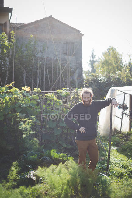 Young man in garden, portrait — Stock Photo