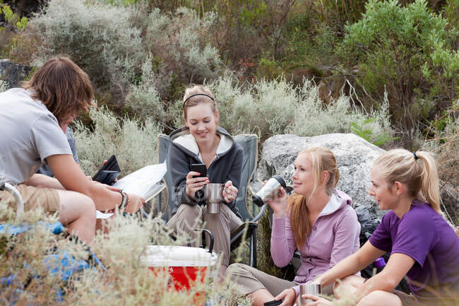 Young group of hikers taking a break — Stock Photo