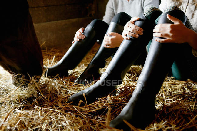 Two people wearing riding boots — Stock Photo
