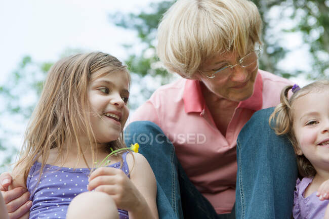 Grandmother with two granddaughters — Stock Photo