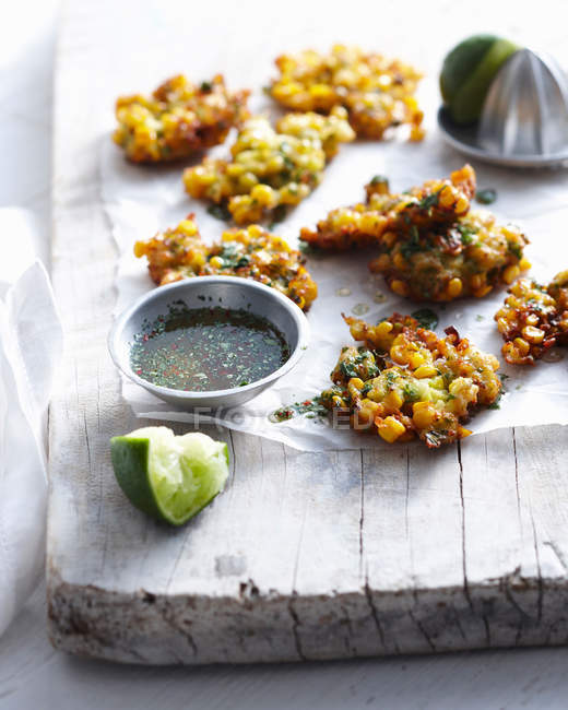 Thai corn fritters on wooden board — Stock Photo