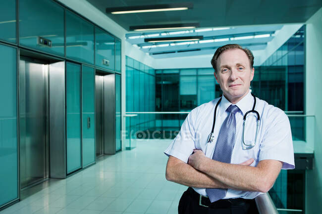 Portrait of doctor with arms folded — Stock Photo