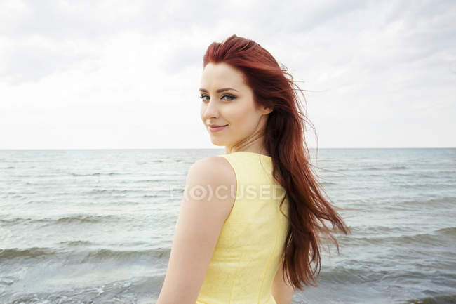 Poetrait of Young woman on beach — Stock Photo