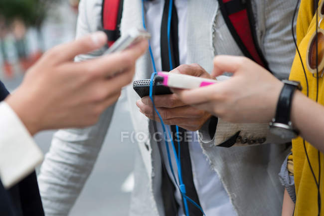 Close up of hands holding mp3 player — Stock Photo