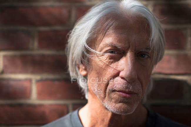 Close of portrait of a mature man outdoors — Stock Photo