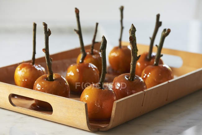 Toffee apples on sticks — Stock Photo