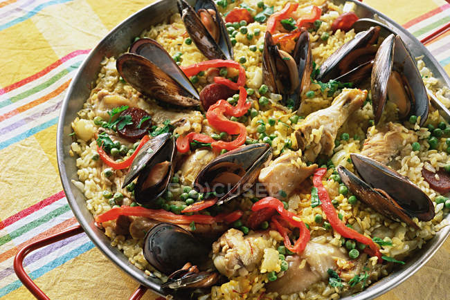 Close up of delicious Paella on table — Stock Photo