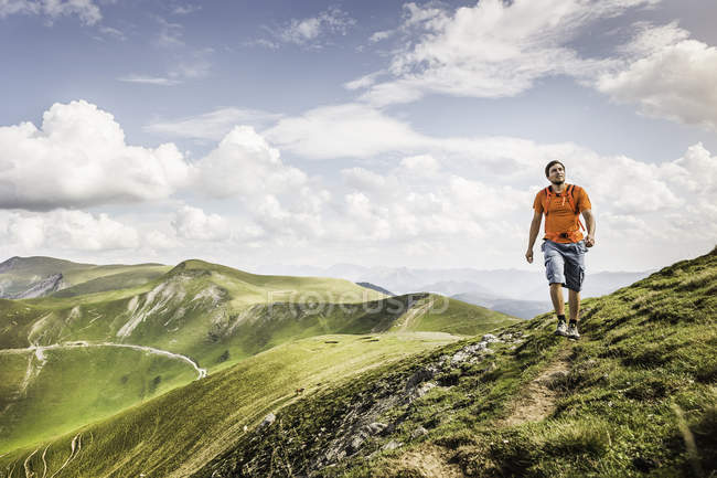 Young man hiking on path, Saint-Michel, Pyrenees, France (Near the Spanish-French border) — Stock Photo