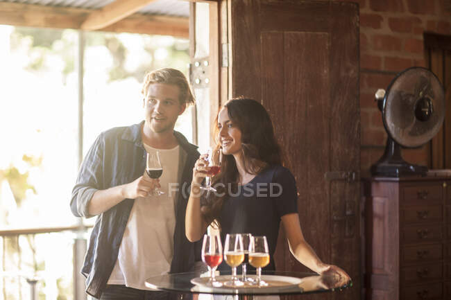 Cape Town, South Africa, young male and female tasting beer in brewery room — Stock Photo