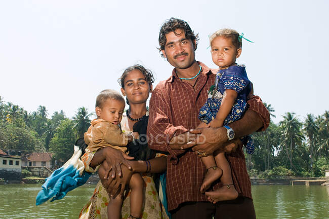 Indian family by communal baths — Stock Photo