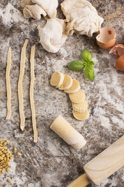 Ingredients for fresh pasta on floured surface, elevated view — Stock Photo