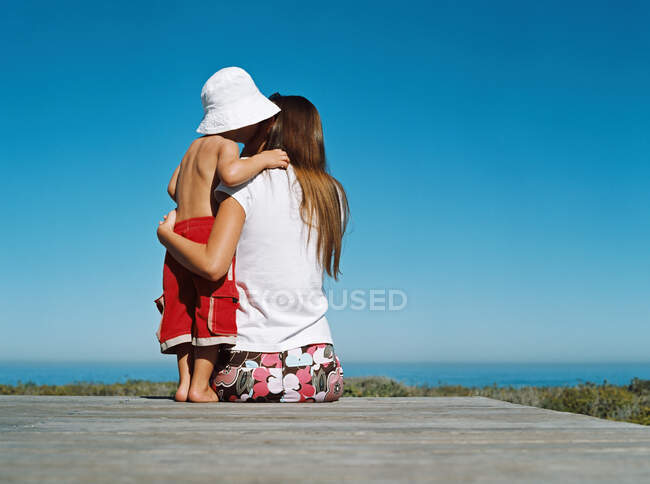 Mother and son on deck — Stock Photo