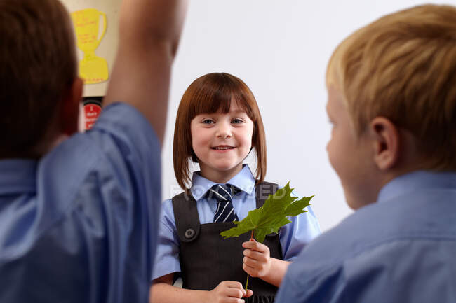 School girl doing a presentation to other classmates — Stock Photo