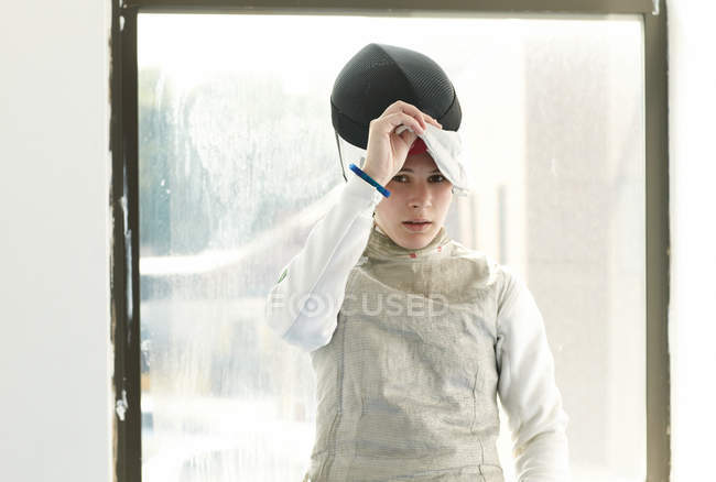Portrait of teenage female fencer — Stock Photo