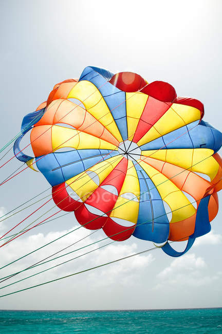 Colourful parasail over sea water — Stock Photo