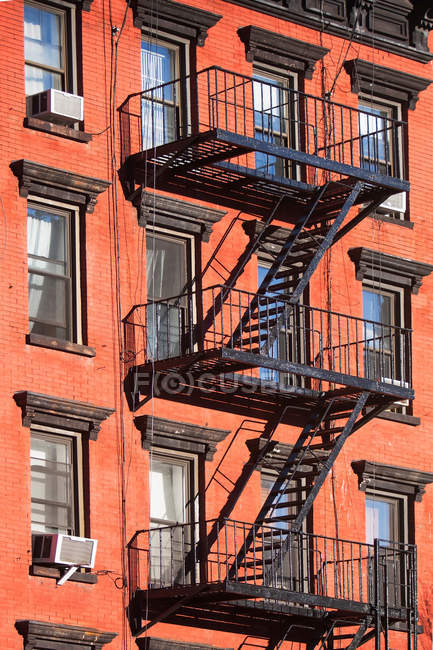 Fire escape stairway red brick building — Stock Photo