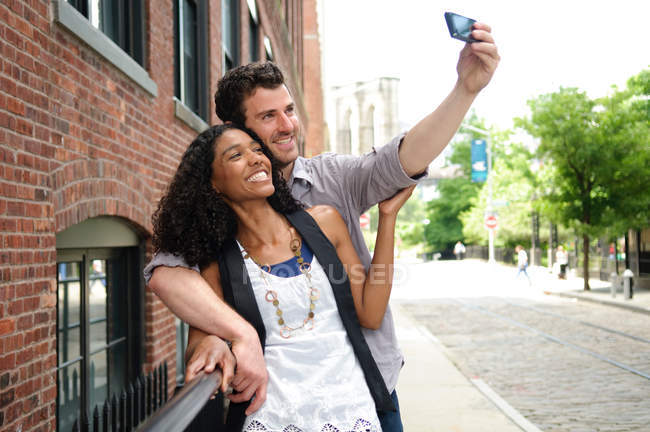 Couple taking a picture of themselves — Stock Photo