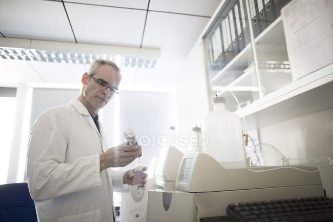 Male meteorologist reading data in weather station laboratory — Stock Photo