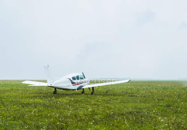 Light aircraft flying parked on airfield — Stock Photo