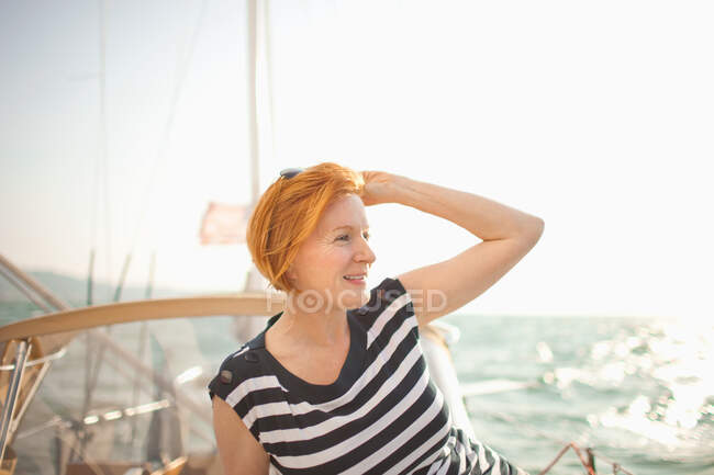 Mature woman on sail boat — Stock Photo