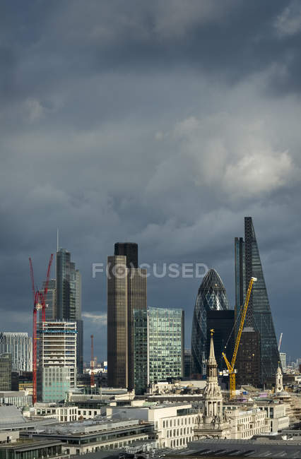 Aerial view of skyscrapers with raind clouds on background, London, UK — Stock Photo