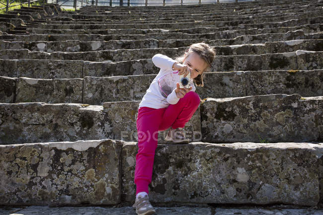Girl photographing stone stairway at ruins, Florence, Italy — Stock Photo