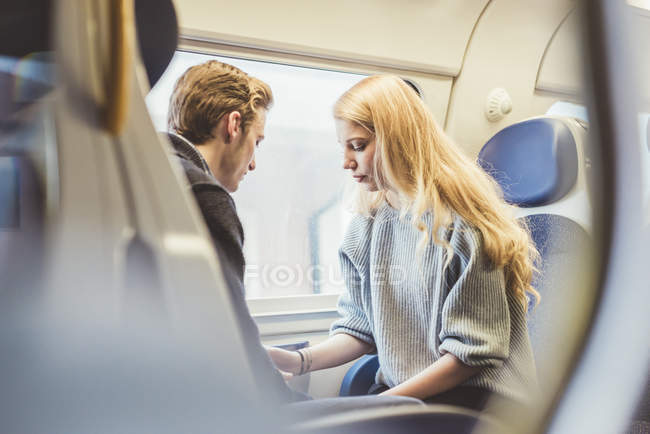 Young couple in train carriage, Italy — Stock Photo