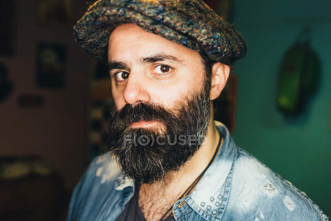 Portrait of mature man, indoors with serious expression — Stock Photo