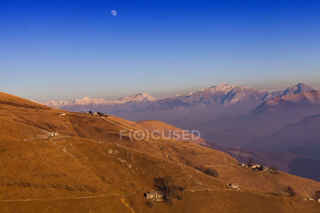 Elevated landscape with distant snow capped mountains, Monte Generoso,Ticino, Switzerland — Stock Photo