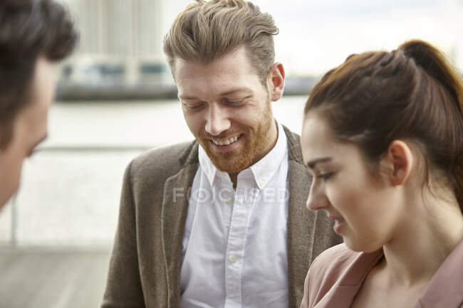 Businesswomen and businessman meeting on waterfront, London, UK — Stock Photo