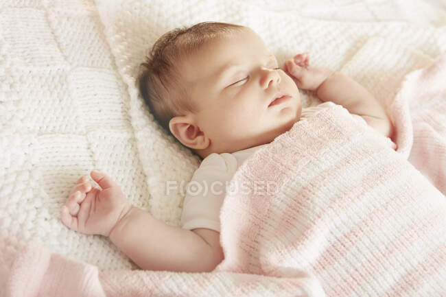 Baby sleeping in bed — Stock Photo