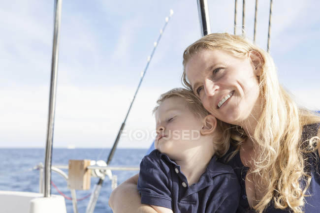 Mother and sleeping son on catamaran near Fuerteventura, Spain — Stock Photo