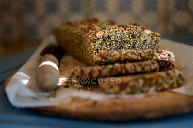 Gluten free seeded bread on cutting board — Stock Photo