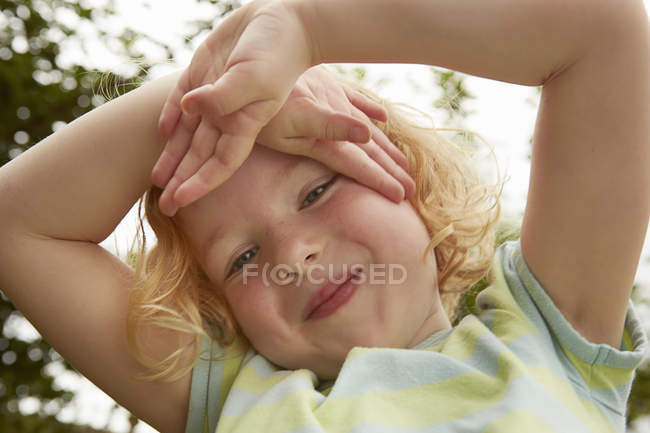 Close up portrait of girl with hands on face — Stock Photo