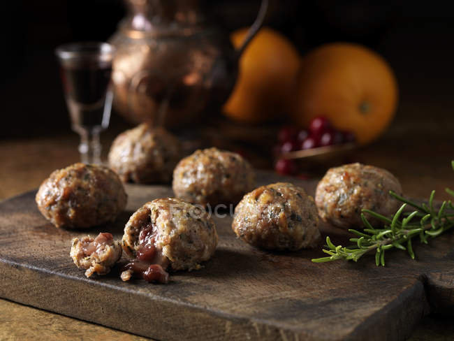 Pork, orange, rosemary stuffing balls with port and cranberry sauce centres — Stock Photo