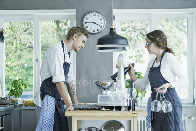 Male and female chefs preparing for event — Stock Photo