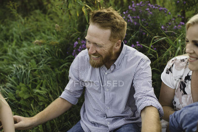 Smiling father with family — Stock Photo
