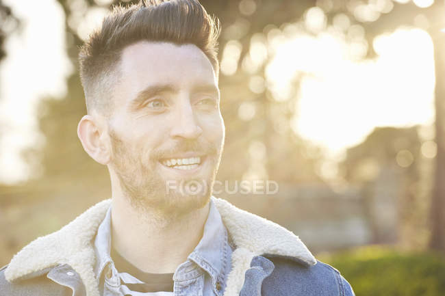 Portrait of bearded young adult man outdoors — Stock Photo
