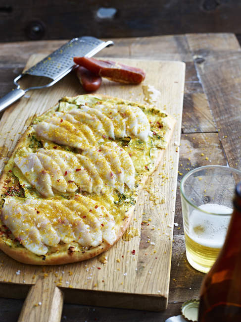 King fish carpaccio pizza on serving board — Stock Photo