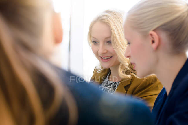 Businesswomen meeting at boardroom table — Stock Photo