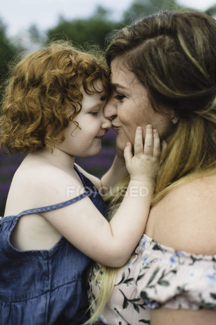 Mother and daughter in lavender field — Stock Photo