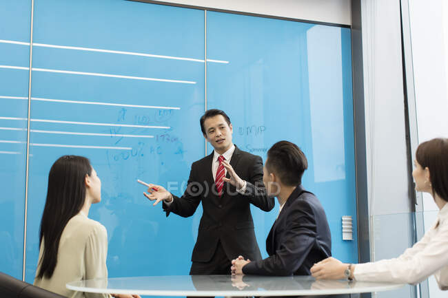 Colleagues having meeting in boardroom — Stock Photo