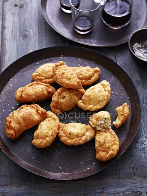 Deep fried calzone on serving plate, elevated view — Stock Photo